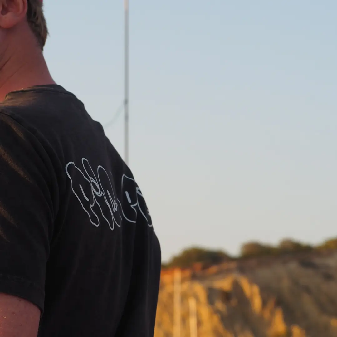 Pica pica t-shirt hanging on a fence