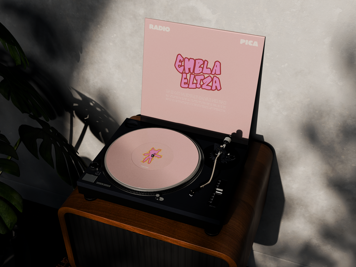 Embla Eliza × Pica Pica vinyl sleeve and record player in afternoon light.